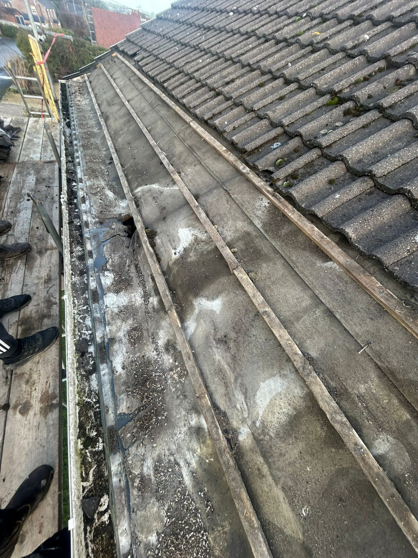 Roof stripped back to battens along the eaves during a pitched roof replacement