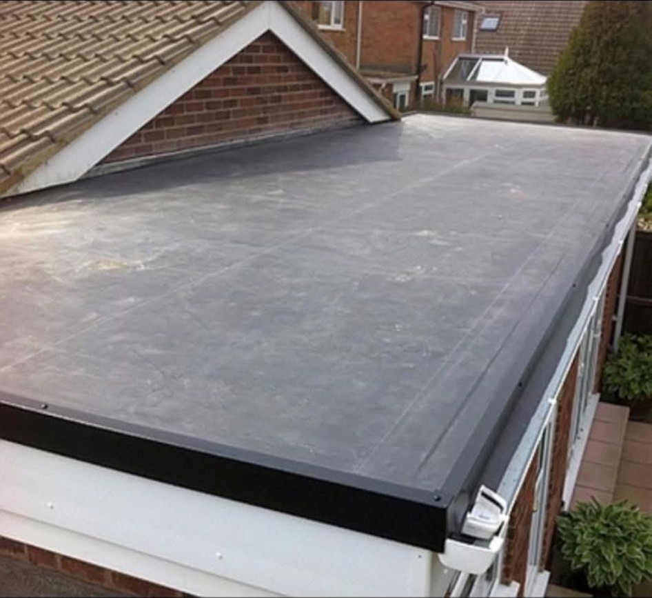 Finished EPDM rubber flat roof on a rear extension with new trims and outlet